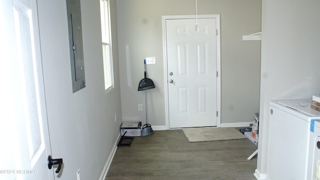 laundry room featuring washer / clothes dryer, hardwood / wood-style floors, and electric panel