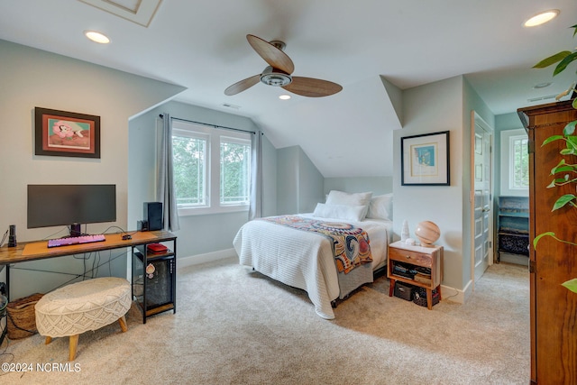 carpeted bedroom with vaulted ceiling and ceiling fan