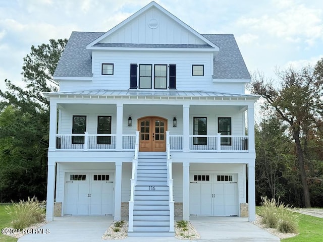 view of front facade with a garage and covered porch