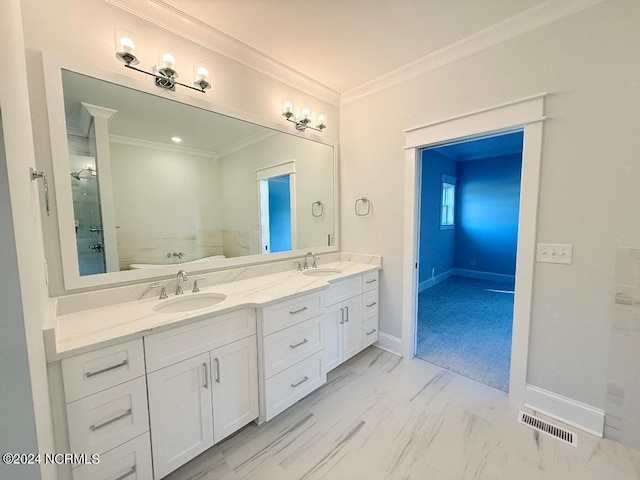 bathroom with toilet, vanity, and ornamental molding