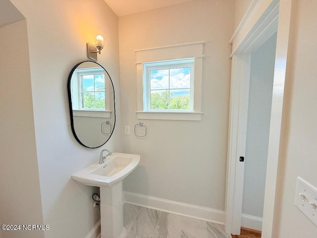 bathroom with a healthy amount of sunlight and sink