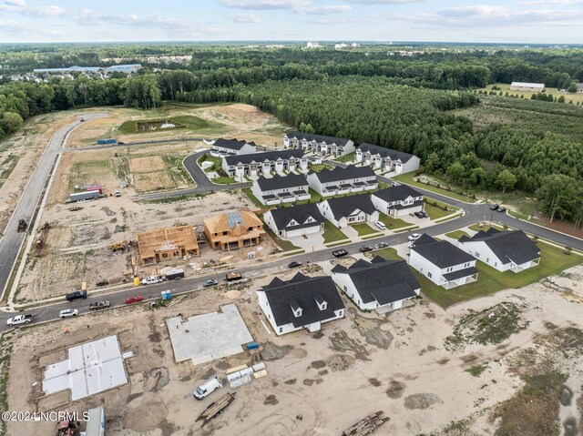 drone / aerial view featuring a view of trees