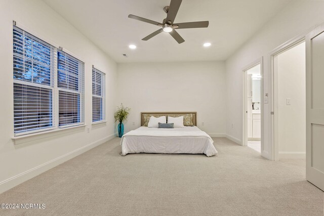 383 James St, Vass, NC 28394 - carpeted bedroom featuring recessed lighting, connected bathroom, baseboards, and a ceiling fan