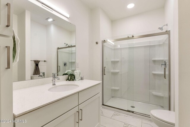 383 James St, Vass, NC 28394 - full bath with a shower stall, toilet, recessed lighting, marble finish floor, and vanity