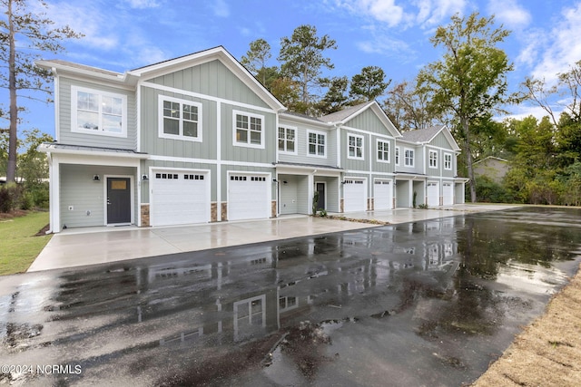 383 James St, Vass, NC 28394 - townhome / multi-family property featuring a garage, board and batten siding, and driveway