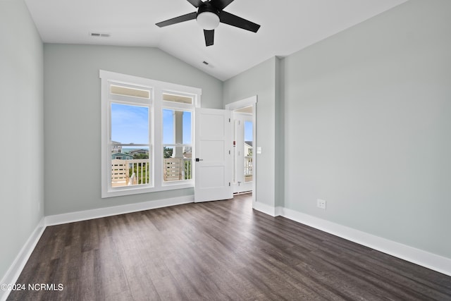 spare room featuring lofted ceiling, ceiling fan, and dark hardwood / wood-style floors