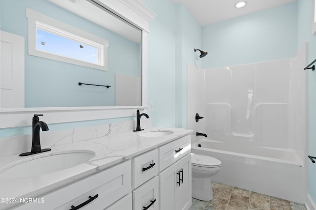 full bathroom featuring shower / bathing tub combination, vanity, and toilet