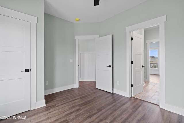 unfurnished bedroom featuring dark wood-type flooring