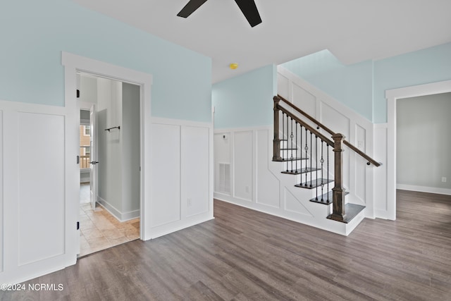 interior space featuring ceiling fan and dark hardwood / wood-style floors