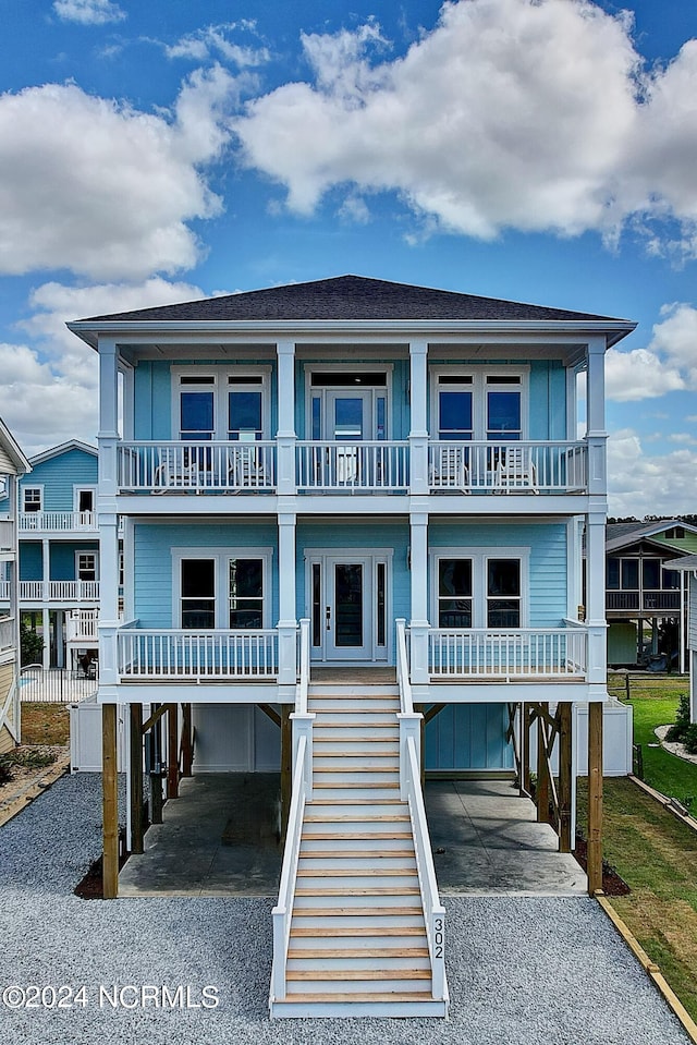 coastal home featuring a balcony