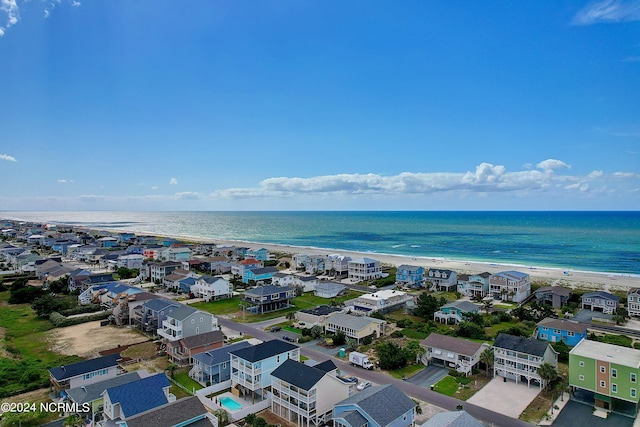 bird's eye view featuring a beach view and a water view