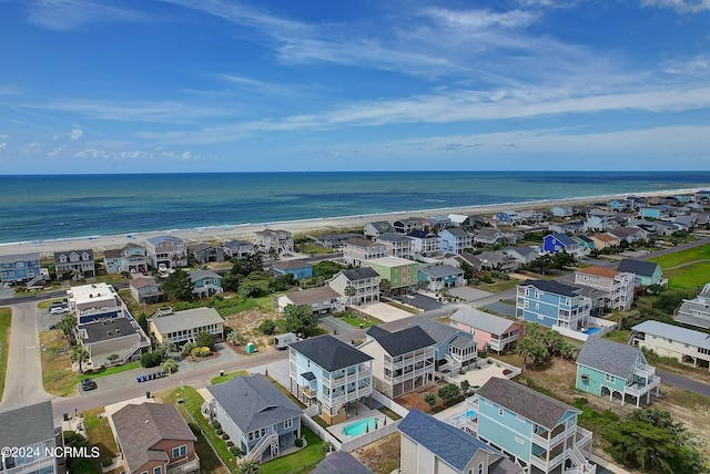 bird's eye view with a view of the beach and a water view