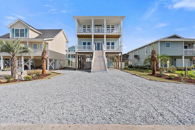 coastal home with a carport and a balcony