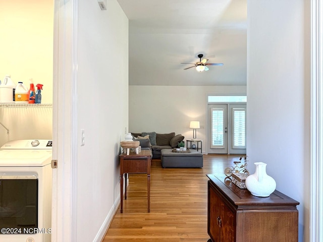 interior space with french doors, washer / clothes dryer, ceiling fan, and light hardwood / wood-style flooring