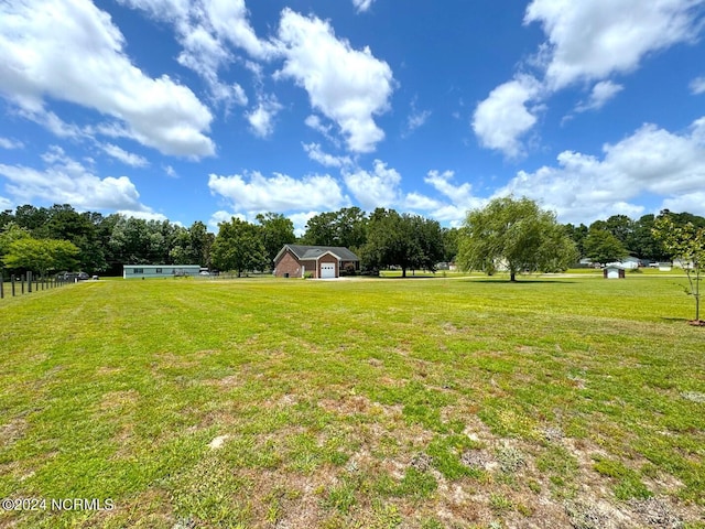 view of yard with a rural view