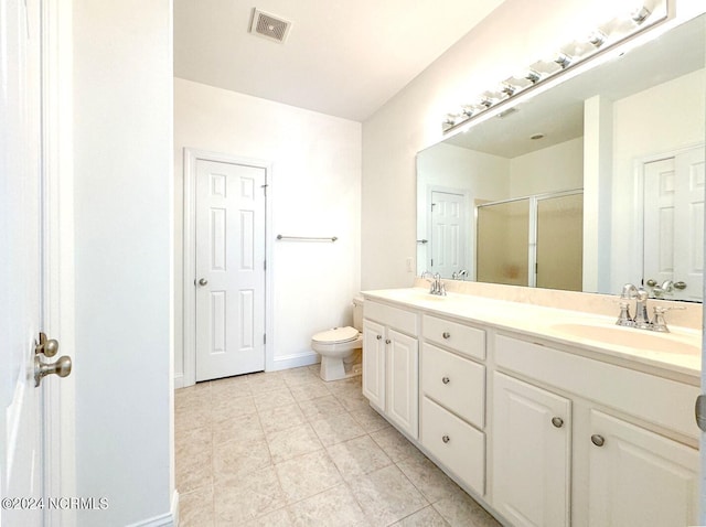 bathroom with vanity, walk in shower, and toilet