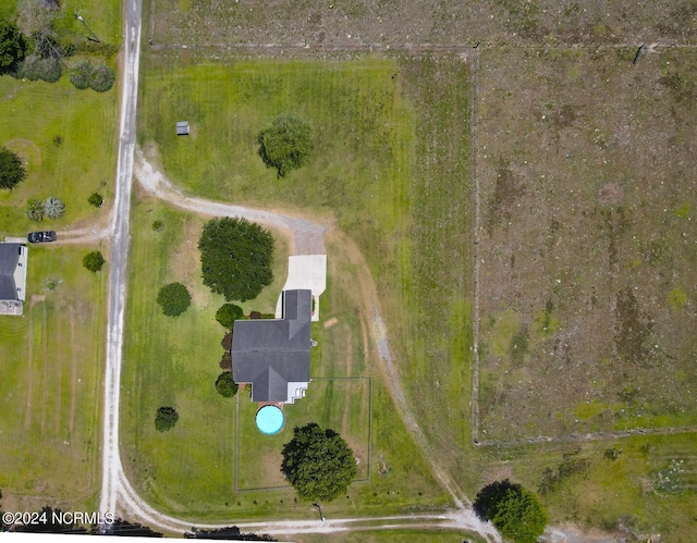 birds eye view of property with a rural view