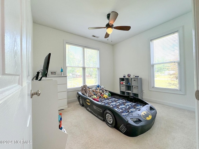 carpeted bedroom with ceiling fan