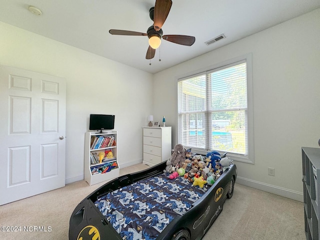 carpeted bedroom with ceiling fan