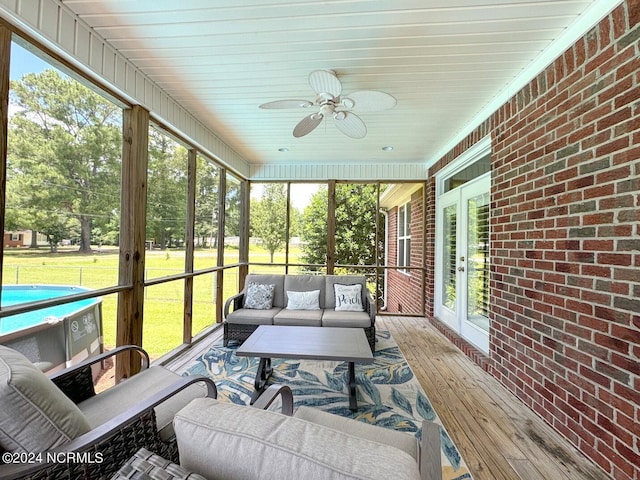 sunroom / solarium with ceiling fan and plenty of natural light