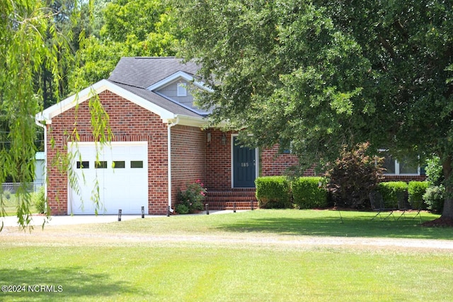 view of front facade featuring a front lawn and a garage