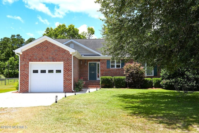 view of front of home with a front lawn and a garage