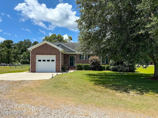 view of front facade featuring a front lawn and a garage