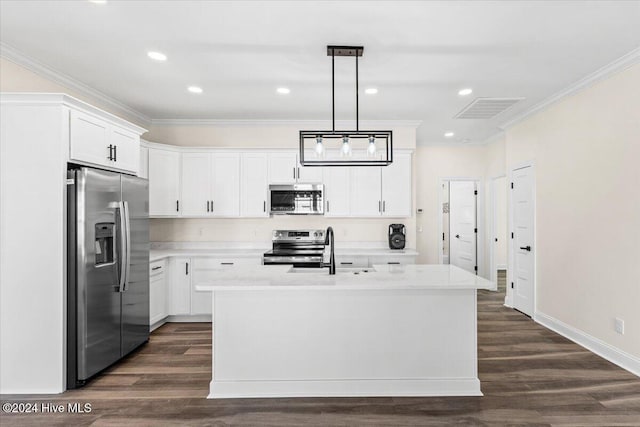 kitchen with pendant lighting, a center island with sink, stainless steel appliances, white cabinetry, and a sink