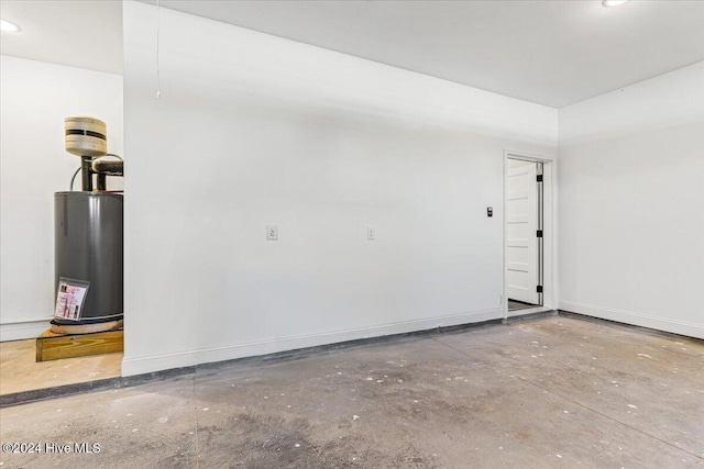 garage with water heater and baseboards