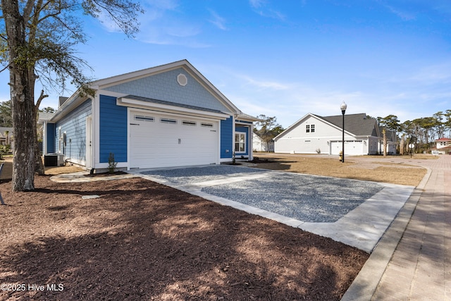 exterior space featuring an attached garage and driveway