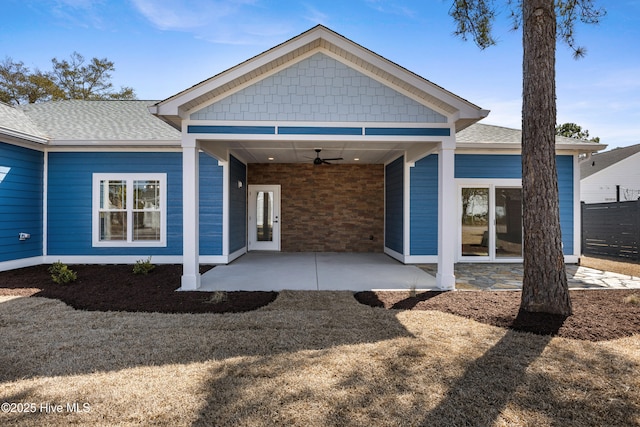 back of house with a patio area, a shingled roof, fence, and a ceiling fan