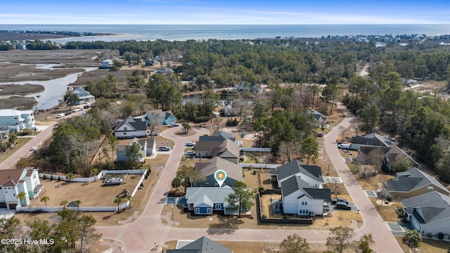 birds eye view of property featuring a residential view and a water view