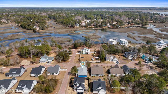 drone / aerial view featuring a water view and a residential view