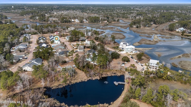 birds eye view of property with a residential view and a water view