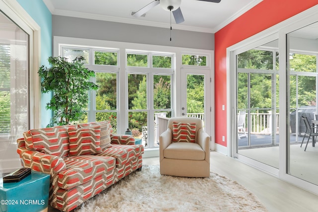 sunroom featuring ceiling fan and a healthy amount of sunlight