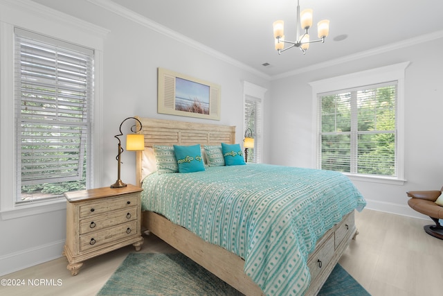 bedroom with crown molding and a chandelier