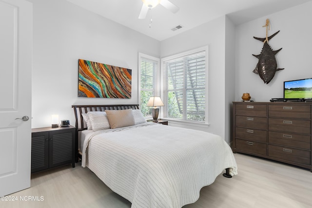 bedroom featuring light hardwood / wood-style floors and ceiling fan