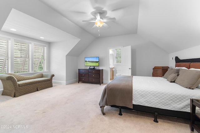 bedroom with ceiling fan, light carpet, and vaulted ceiling