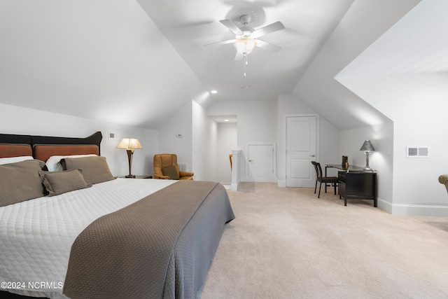 bedroom featuring light carpet, vaulted ceiling, and ceiling fan