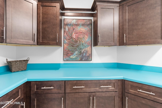 kitchen featuring dark brown cabinets