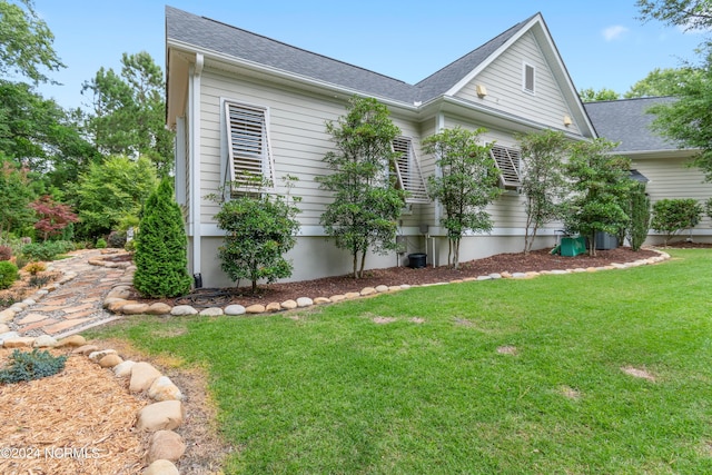 view of property exterior featuring a yard