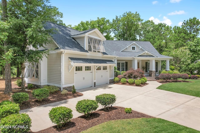 craftsman-style home featuring a porch and a garage