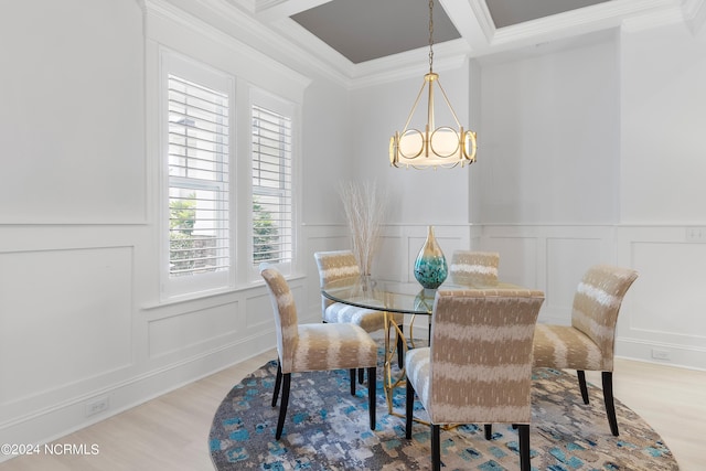 dining area featuring crown molding, beamed ceiling, light hardwood / wood-style floors, and an inviting chandelier