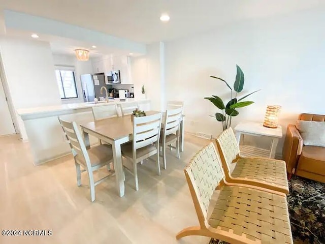 dining room featuring sink