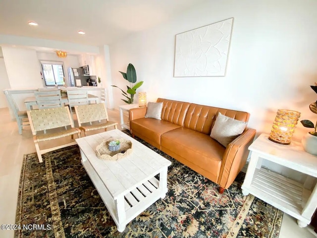 living room featuring a notable chandelier