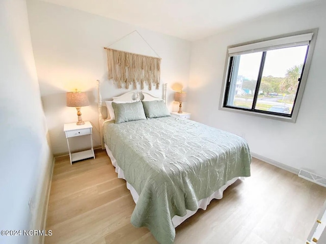 bedroom with light wood-type flooring