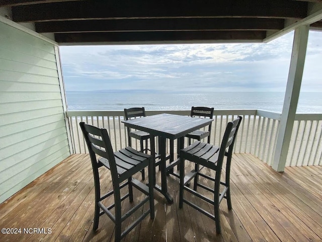 wooden terrace with a water view