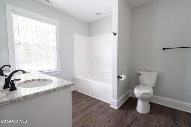 full bathroom featuring a wealth of natural light, shower / bath combination, toilet, wood-type flooring, and vanity