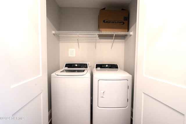 washroom with separate washer and dryer