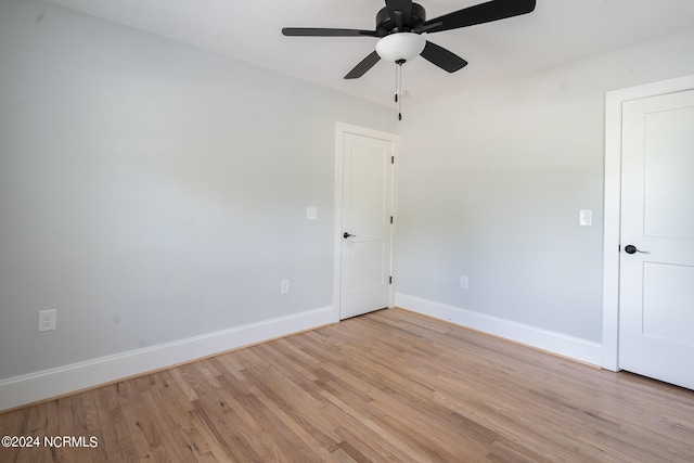 unfurnished room featuring light wood-type flooring and ceiling fan